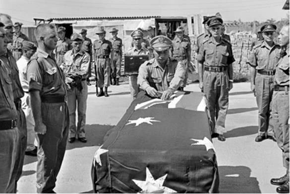 A South Vietnamese general pins a gallantry medal on Kevin Wheatley’s coffin.